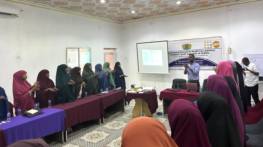 Participant demonstrating hand washing steps 