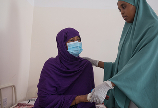 Patient and midwife at Hargeisa Group Hospital