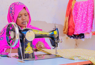 Maryan working on her sewing machine