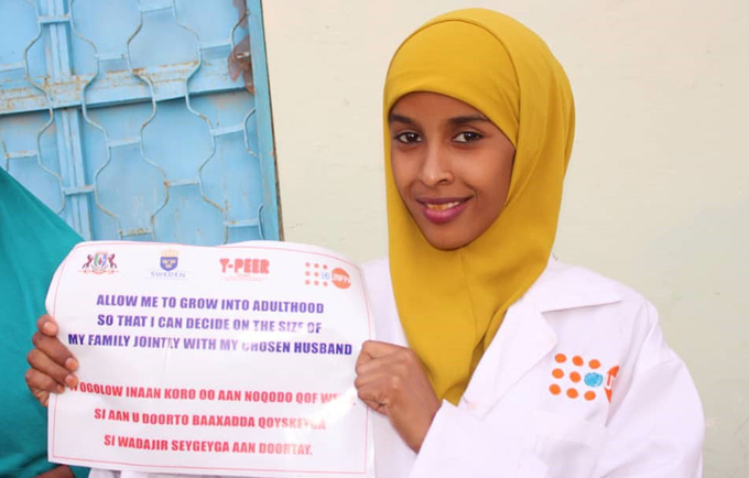 Farhiya participating in a child and early marriage campaign in 2018
