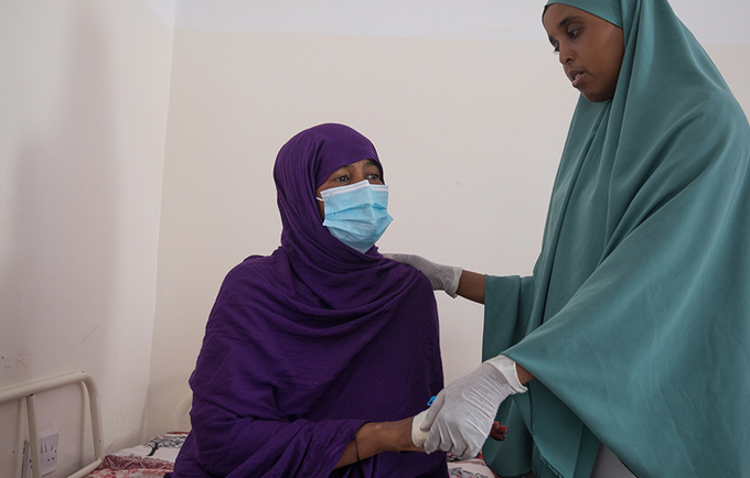 Patient and midwife at Hargeisa Group Hospital