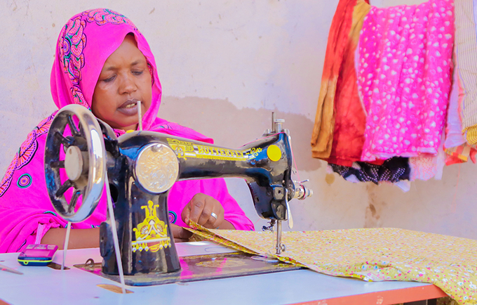 Maryan working on her sewing machine