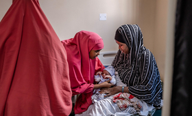 UNFPA trained midwife with a newborn baby at Banadir Hospital, Mogadishu