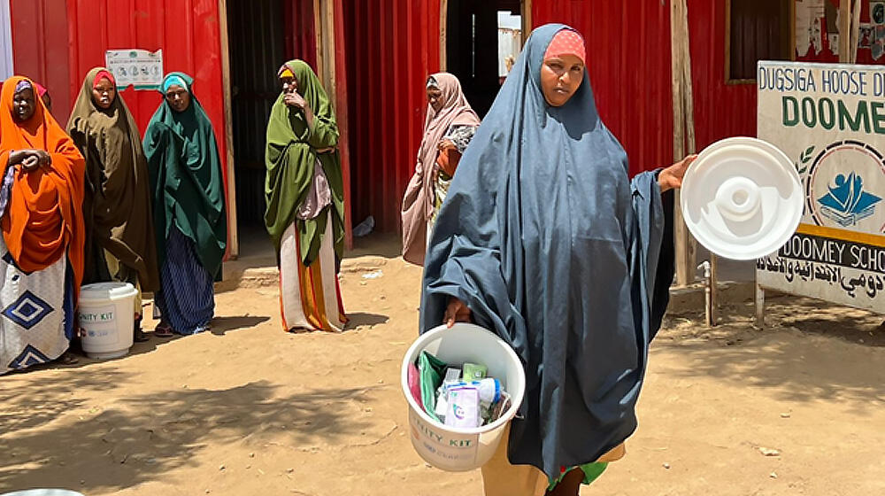 Ifrah showing off the Dignity Kit she received 