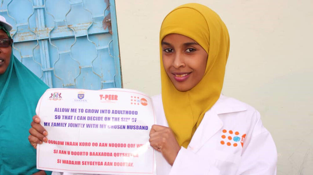 Farhiya participating in a child and early marriage campaign in 2018