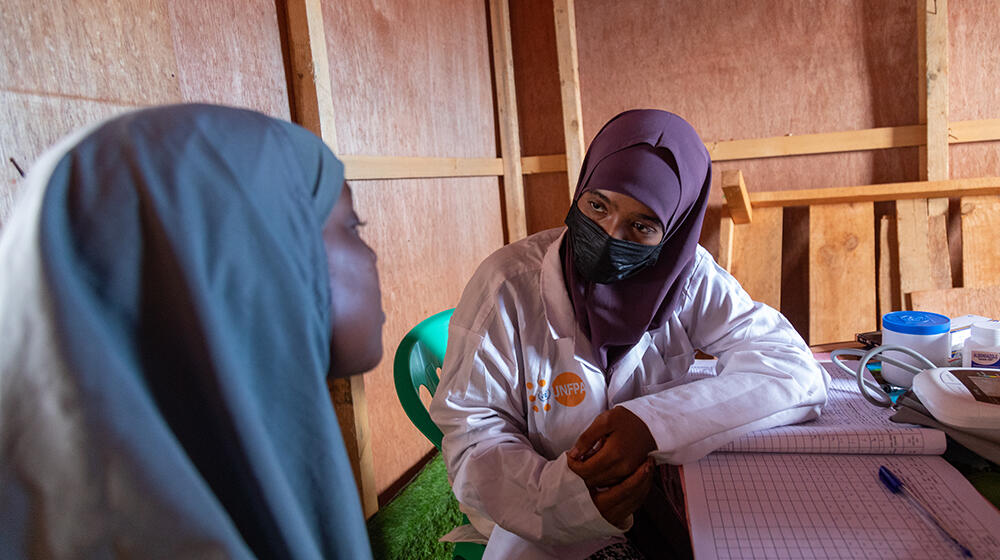 A counseling session involving a UNFPA employee and a survivor