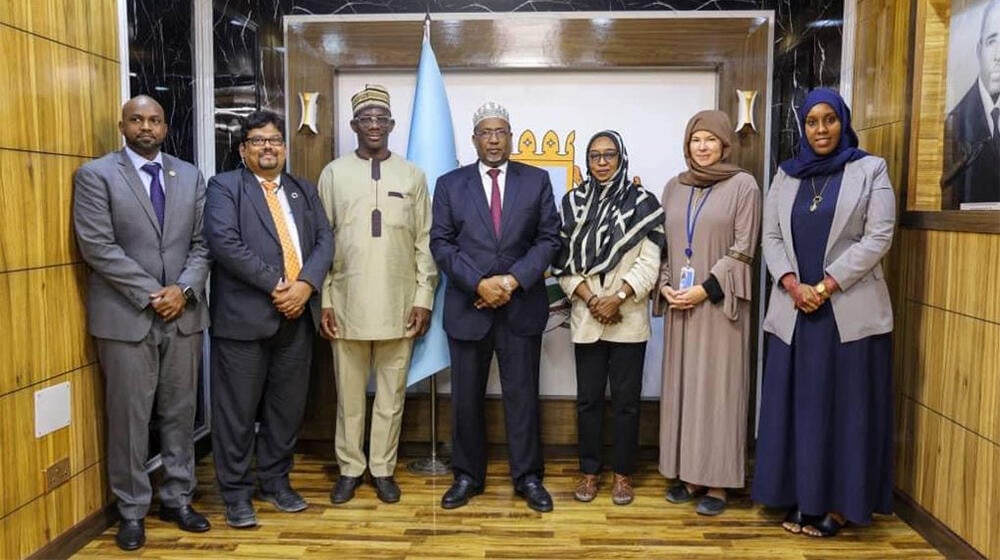 The Speaker of the House of the People, Sheik Adam Mohamed Nour [middle] with principal parliamentary officers and members of th