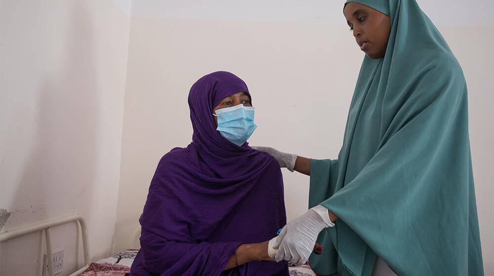 Patient and midwife at Hargeisa Group Hospital